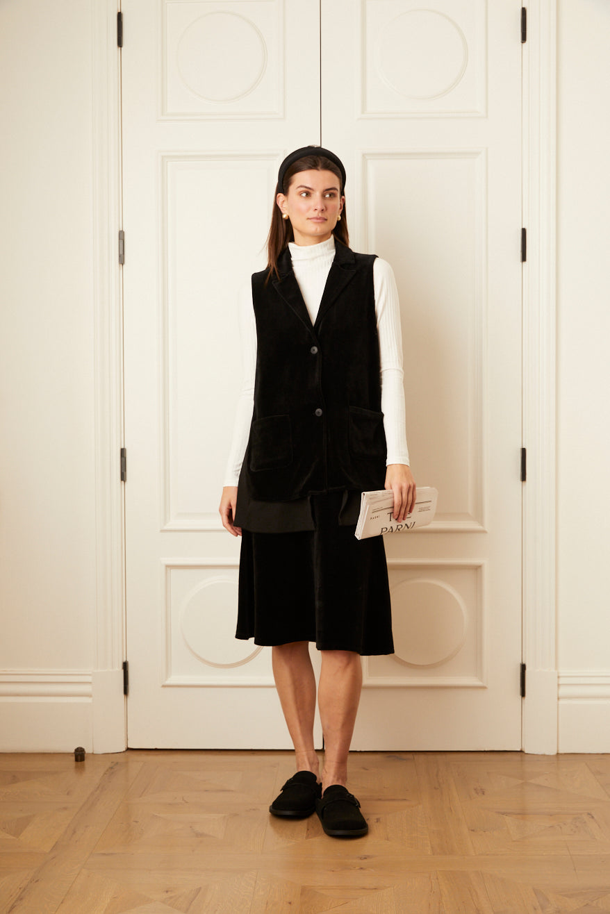 Model wearing the black Sleeveless Velour Vest.