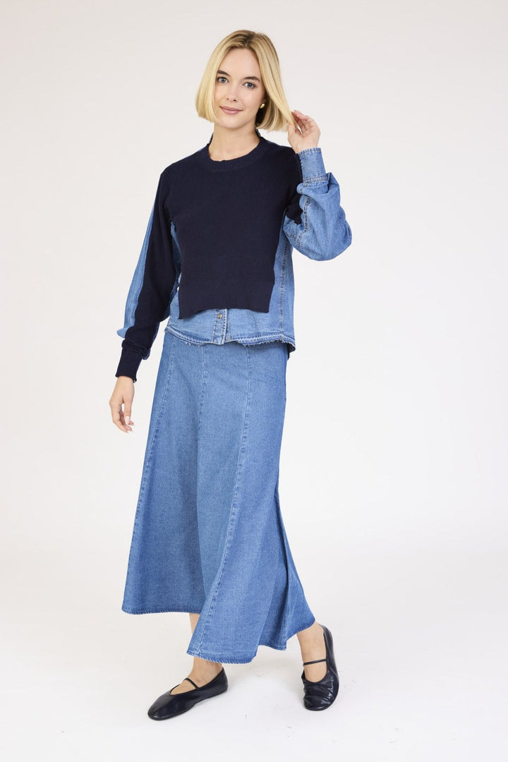 Model wearing the Denim Knit Mixed Media Top in Blue with denim skirt.