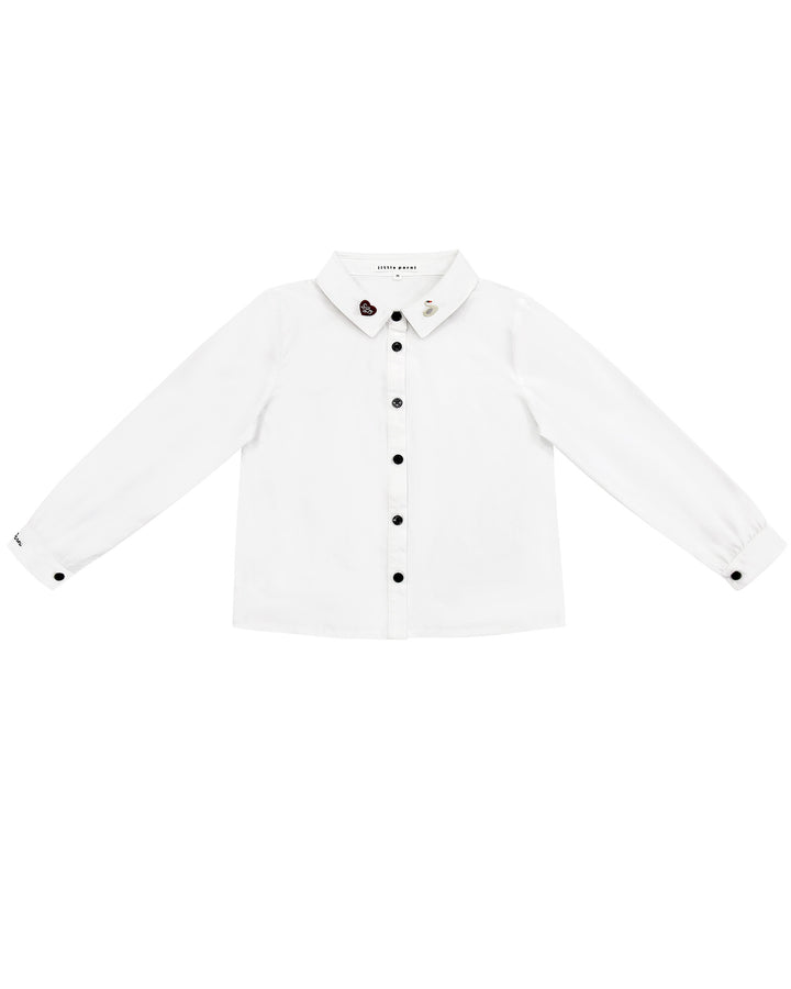 White shirt with black buttons on a white background