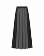 A pleated midi skirt with alternating vertical panels of black and textured gray wool, shown against a plain white background.