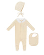 Baby outfit set with onesie, bonnet, and bib on a white background