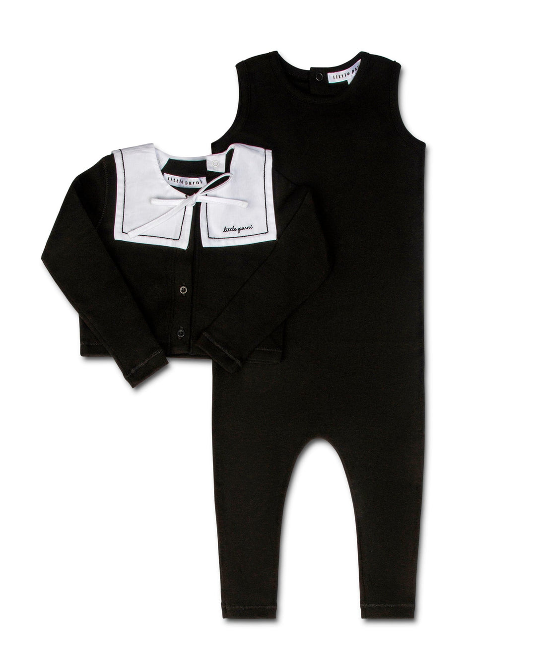 Black baby outfit with white collar and bow tie on a white background