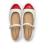 White shoes with red soles on a white background