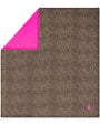 Brown textured blanket with pink corner on a white background