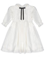 White dress with a black ribbon on a white background