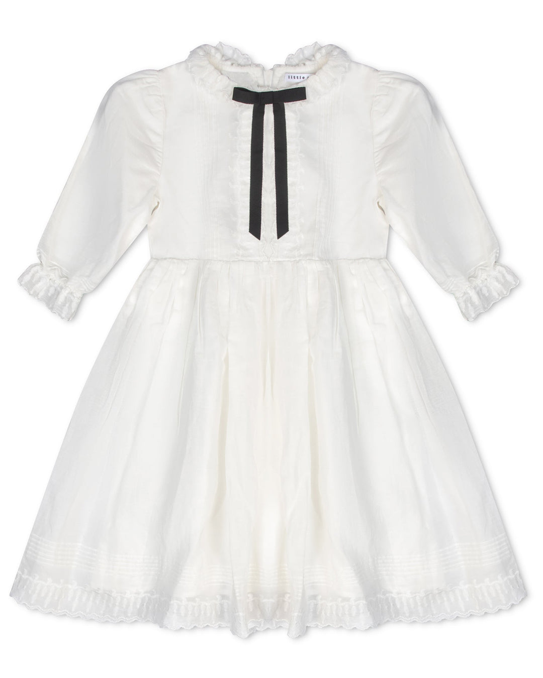 White dress with a black ribbon on a white background