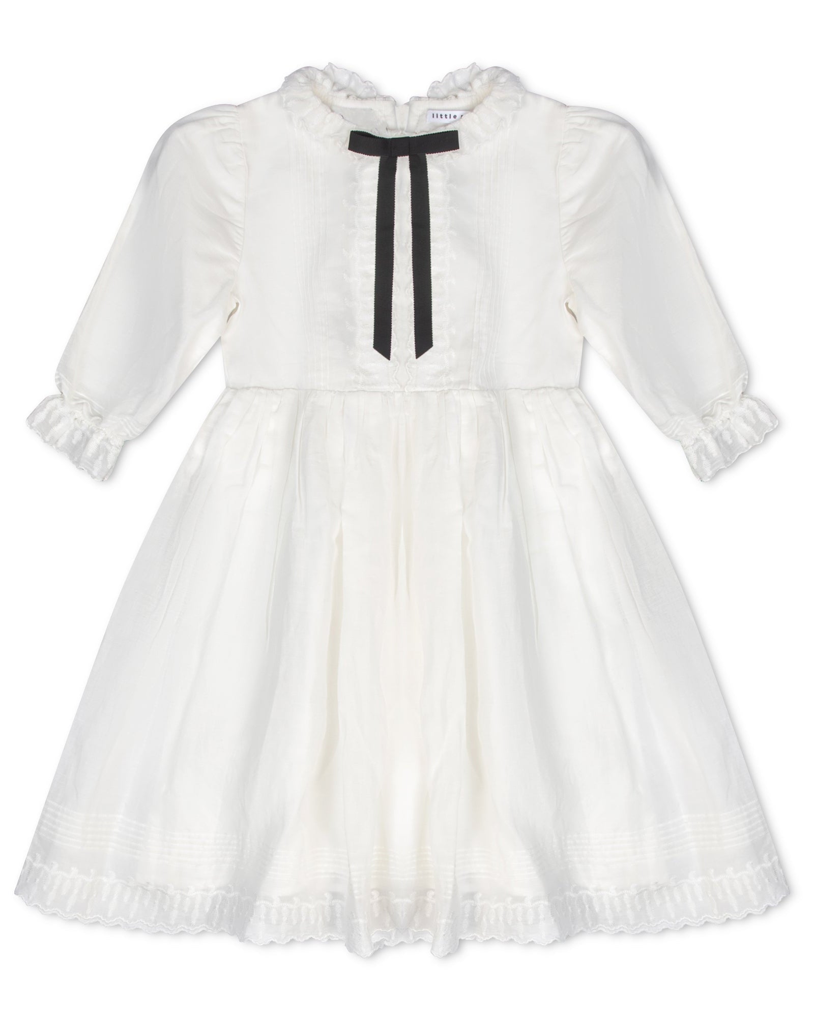 White dress with a black ribbon on a white background