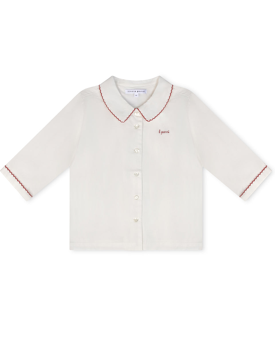 White shirt with red trim on a white background