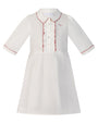White dress with red trim on a white background