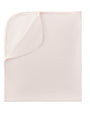 Folded pink blanket on a white background