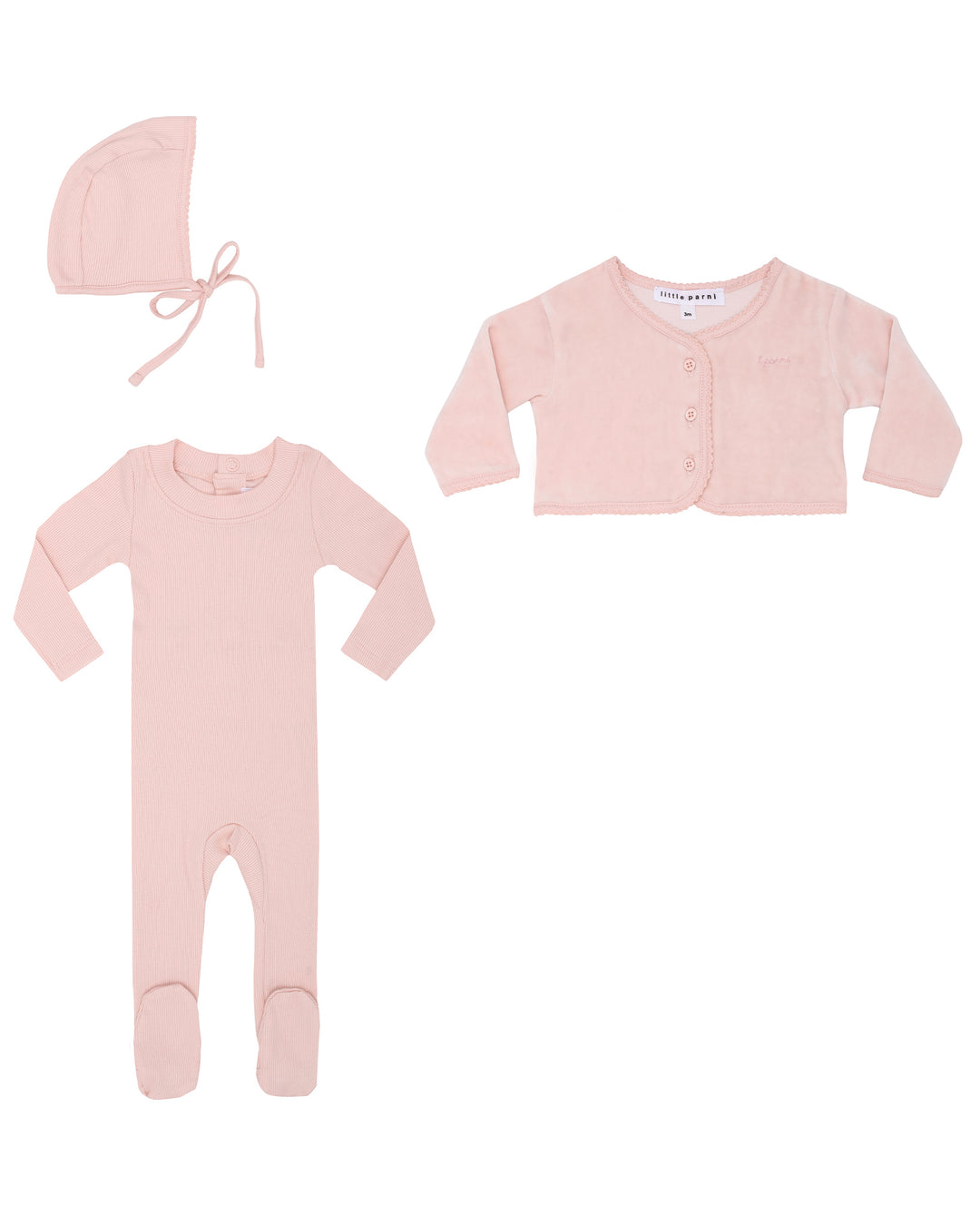 Set of pink baby clothing including a onesie, cardigan, and bonnet on a white background.