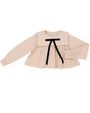Beige blouse with a black ribbon on a white background