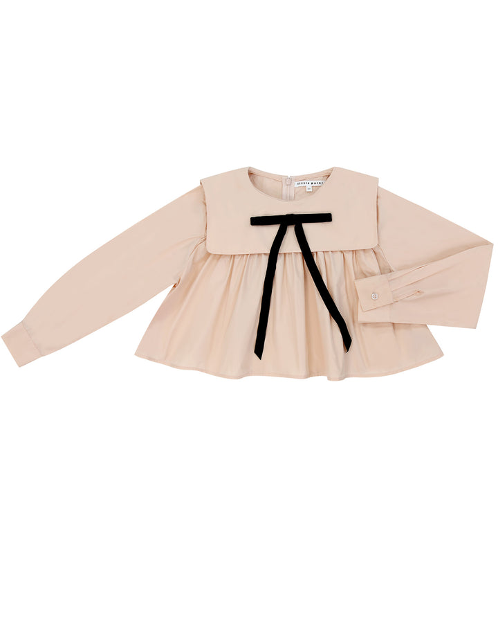 Beige blouse with a black ribbon on a white background