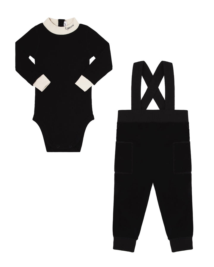 Black baby romper with white collar and black baby overalls on a white background