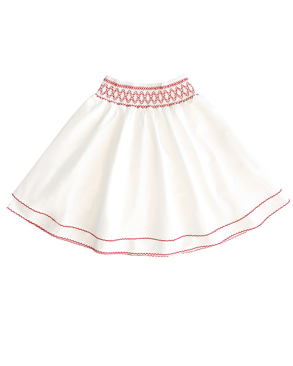 White skirt with red embroidery on a white background