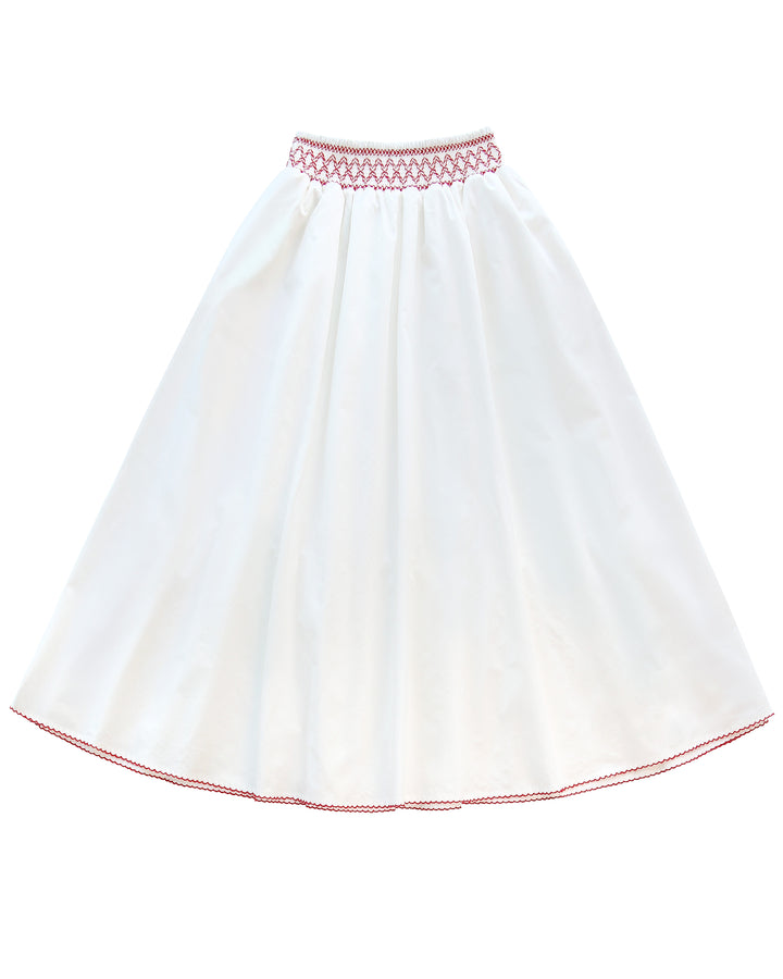 White skirt with red embroidery on a white background