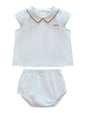 White sleeveless top and bloomers set with black trim on a white background