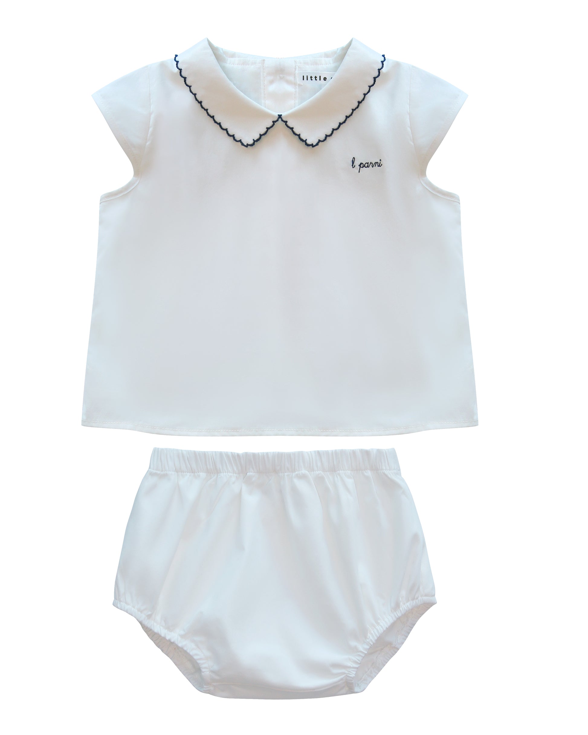 White sleeveless top and bloomers set with black trim on a white background