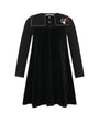 A black long-sleeve velvet dress with a wide collar featuring white piping and a small embroidered floral accent on the right side, shown against a plain white background.