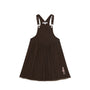 A dark brown corduroy pinafore dress with adjustable shoulder straps, a gathered waist, and a small embroidered character on the lower left hem, shown against a plain white background.