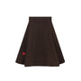 A dark brown flared skirt with a small red heart patch on the lower left side, shown against a plain white background.