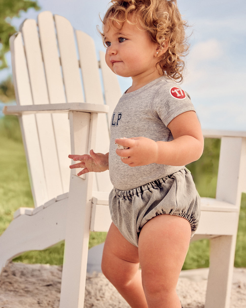 Girl wearing the grey Kids LP Est. Short Sleeve Tee.