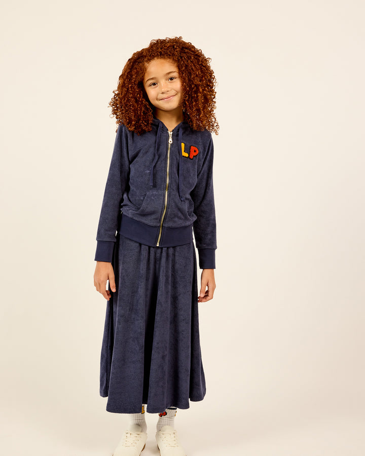 Girl wearing the Girls French Terry Zip-Up Hoodie and Skirt Set.
