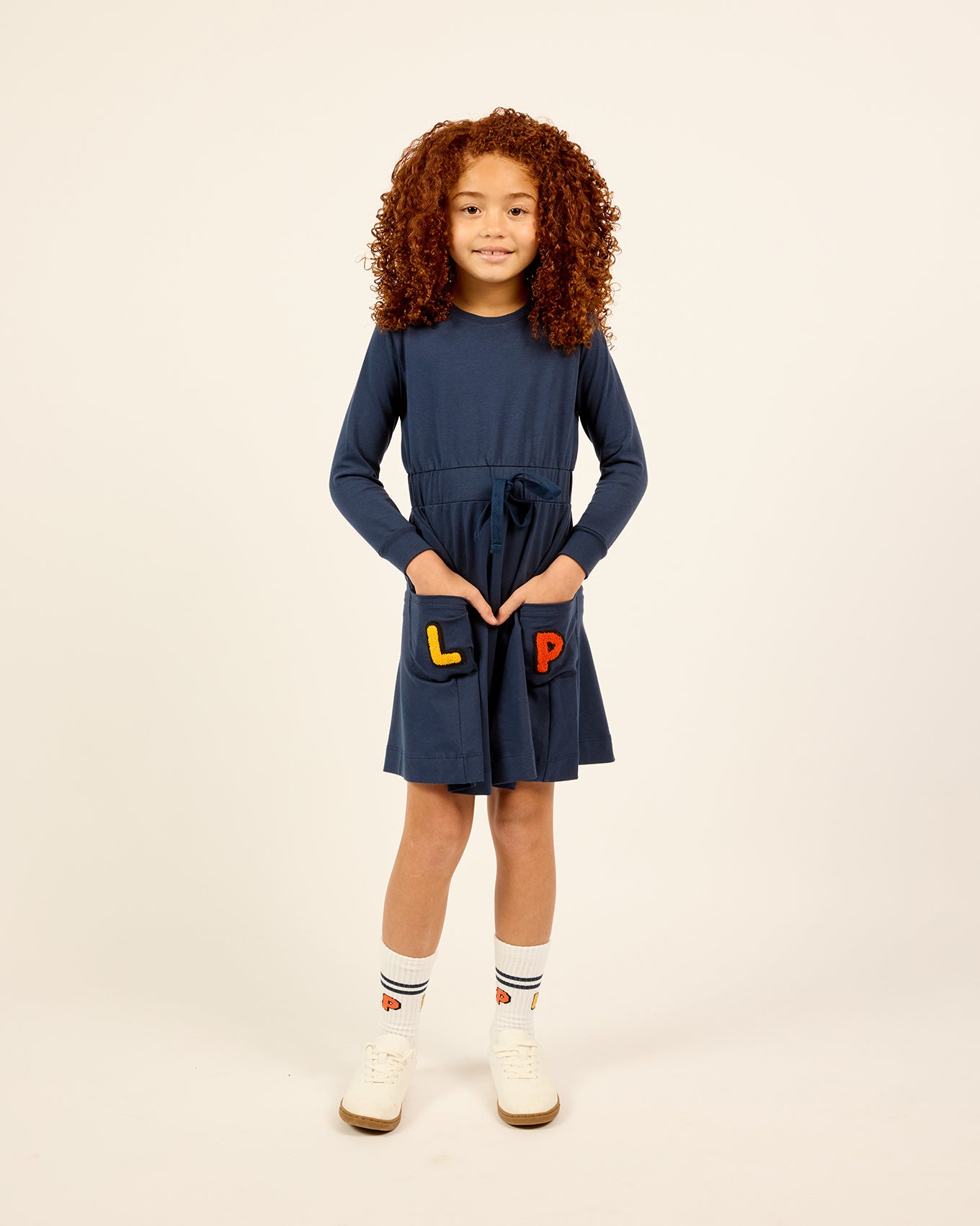Model wearing the LP Pocket Dress in blue.