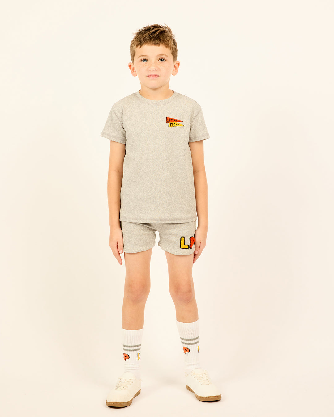 Boy wearing the Boys' LP Track Shorts in grey.