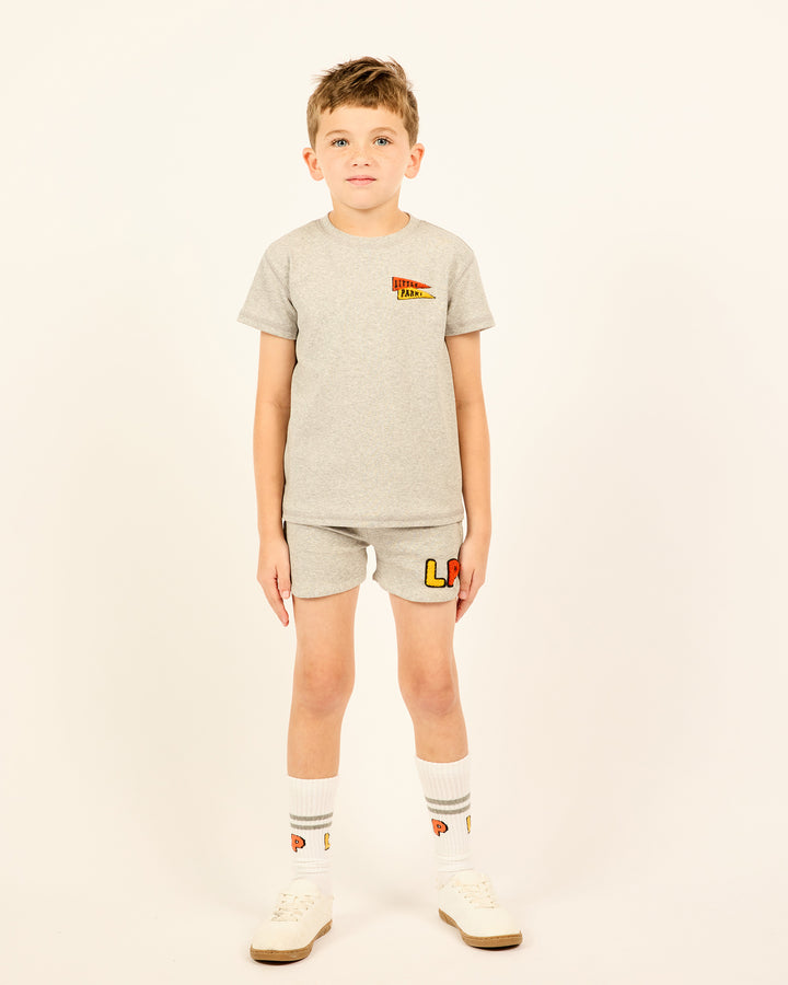 Boy wearing the Boys' LP Track Shorts in grey.