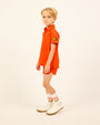 Boy wearing the orange Boys' LP Track Shorts.