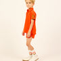 Boy wearing the orange Boys' LP Track Shorts.