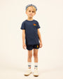 Boy wearing the navy Boys' LP Track Shorts.