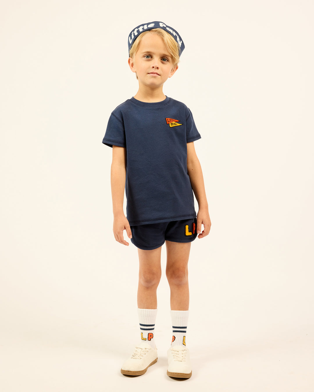 Boy wearing the navy Boys' LP Track Shorts.