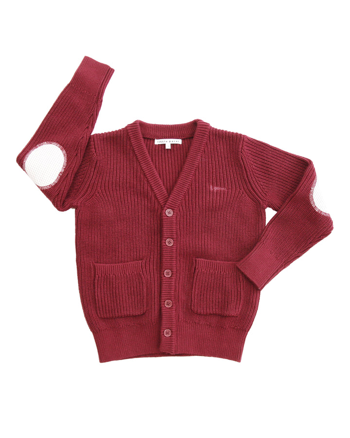 Red cardigan with button details on a white background