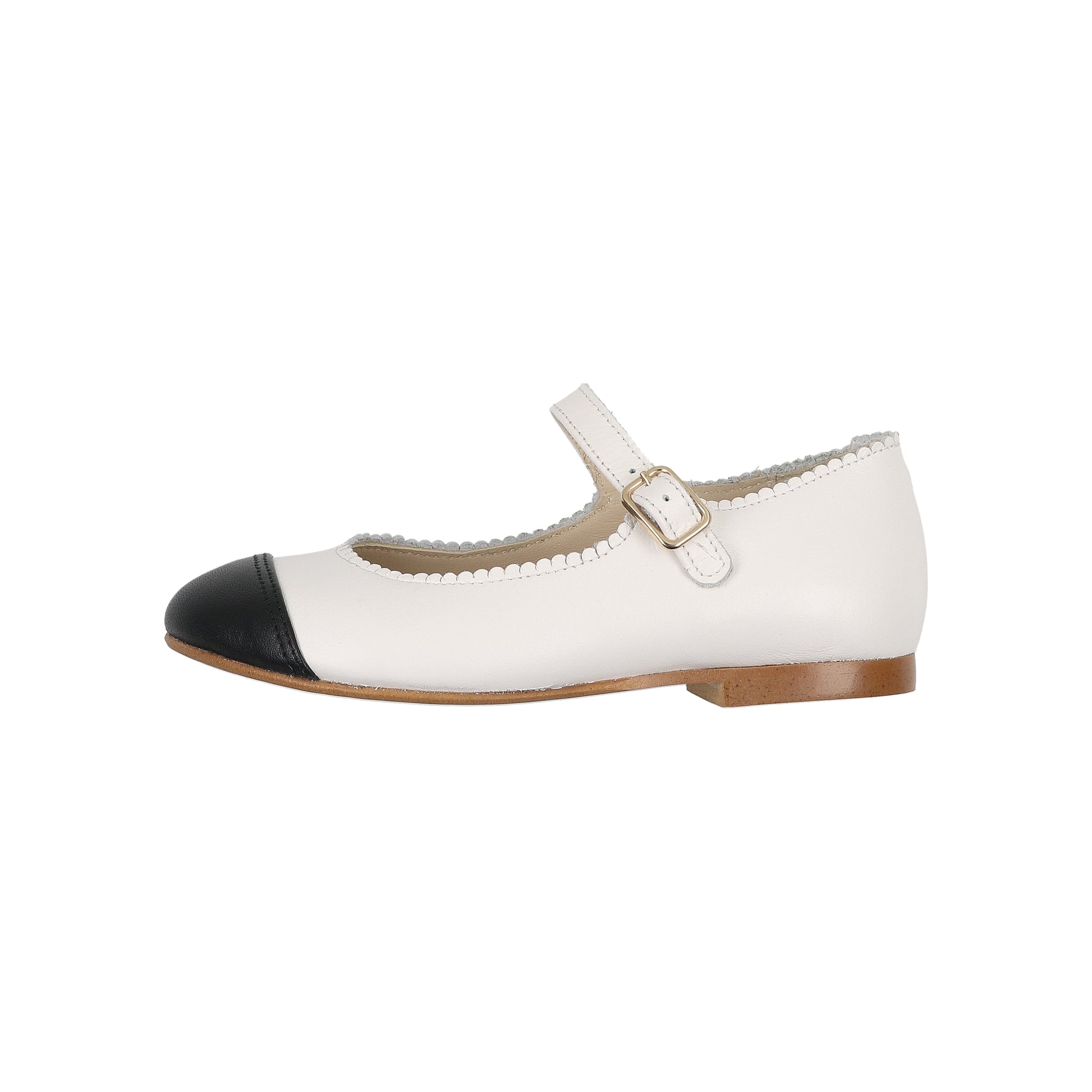 White shoe with black cap toe on a white background