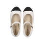 Pair of black and white shoes with 'little parini' branding on a white background