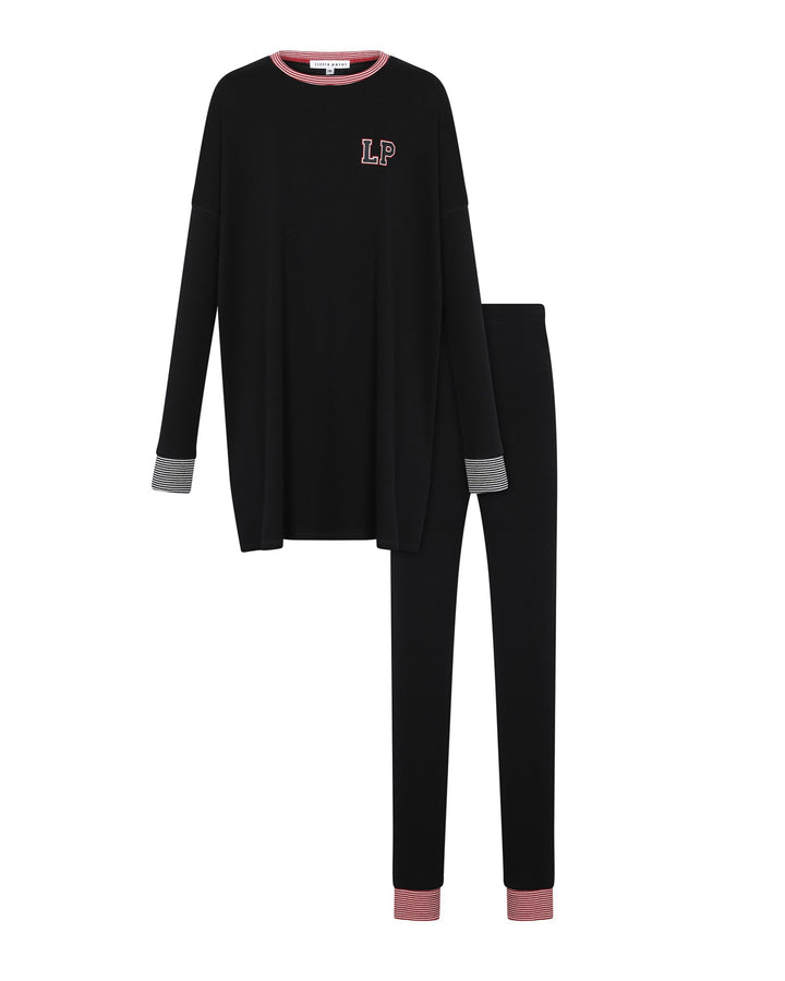 Black pajama set with pink accents on a white background