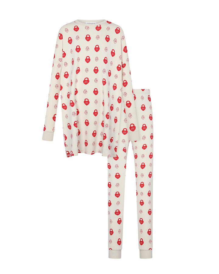 Long-sleeve pajama top and pants with red pattern on a white background
