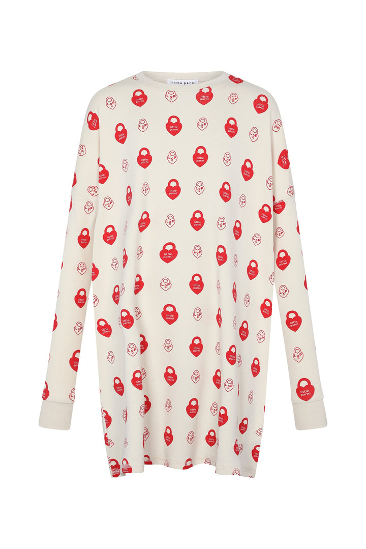 White long-sleeve pajama top with red pattern on a white background