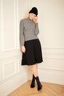 Model wearing the black ivory Striped Dolman Sleeve Turtleneck.