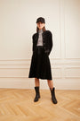 Model wearing the Velour Drawstring Short Skirt in black.