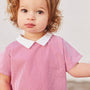 Little girl wearing the Baby Two Piece Striped Cotton Shorts Set close up in the top in pink and white stripe