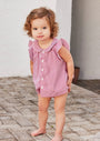 Little girl wearing the Baby Striped Ruffle Tunic & Bloomer Set in pink and white
