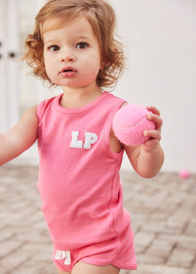 Little girl wearing the hot pink Varsity Tank top and shorts