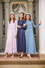 Three young wearing the sleeveless max dress layered with crop tops.