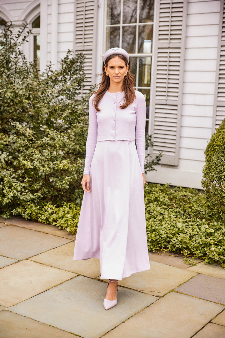 Young woman wearing the Spring lavender ribbed cropped cardigan, long sleeve with rhinestone buttons with matching maxi skirt