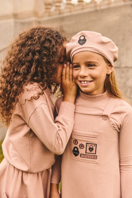 Two girls wearing the Little Parni Urban collection.