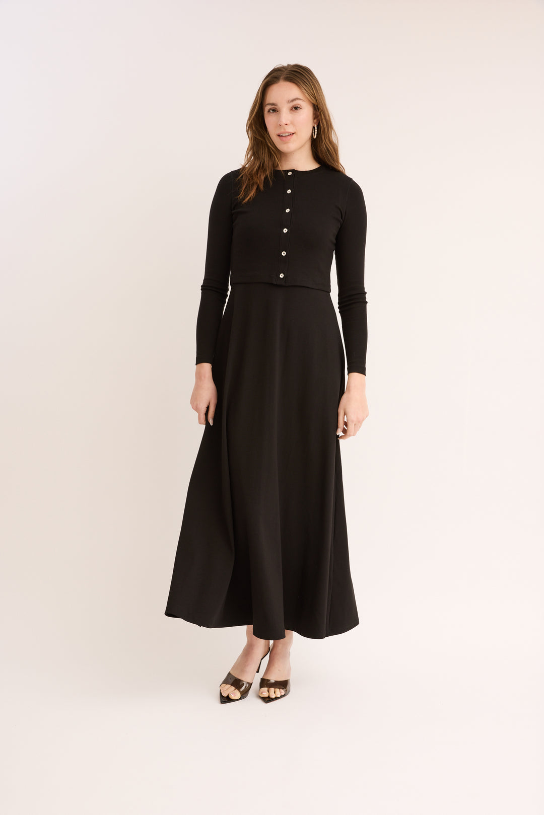 Woman wearing the Maxi Jumper Cardigan Set buttoned. 