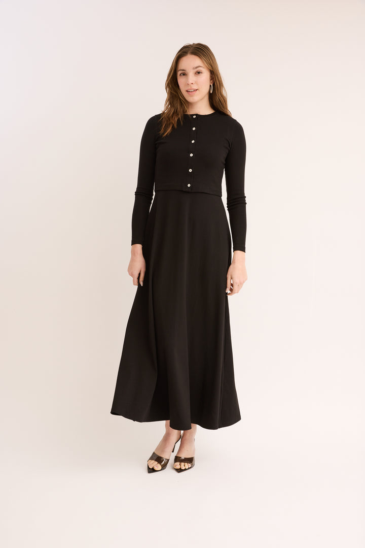 Woman wearing the Maxi Jumper Cardigan Set buttoned. 